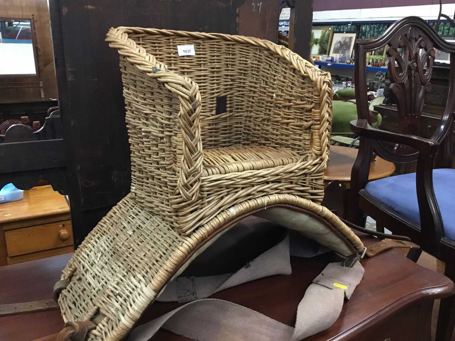 Lot 1037 - Childs vintage wicker pony seat with straps