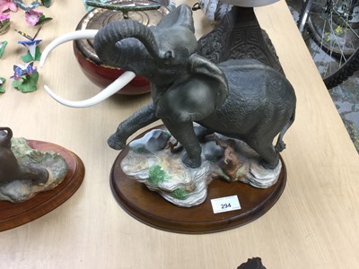 Lot 294 - Franklin Mint porcelain figure of an elephant, together with another of a Rhino (2)