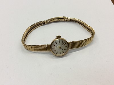 Lot 715 - 9ct gold ladies Tissot wristwatch, Orvis wristwatch, two 9ct gold studs and one other gold plated and a hard stone bead necklace