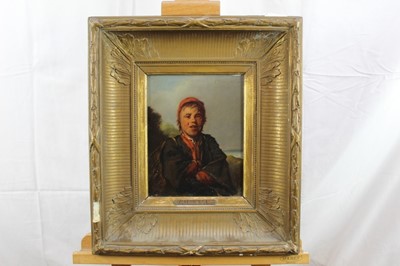 Lot 98 - Good oil on panel depicting young man standing on coastal rocks
