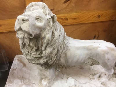 Lot 27 - Plaster sculpture of a lion, on naturalistic base, 46cm long
