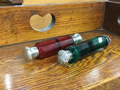 Lot 720 - Victorian cranberry glass scent bottle together with another emerald green glass scent bottle (2)