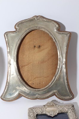 Lot 26 - Large Edwardian silver photograph frame with reeded borders and oval photograph aperture (Birmingham 1905) together with a group of eight other silver photograph frames various dates and makers (9)