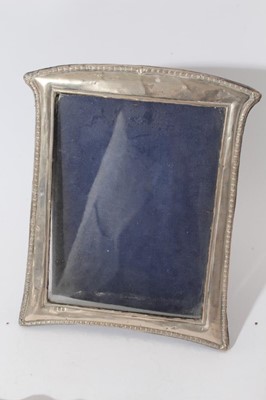 Lot 26 - Large Edwardian silver photograph frame with reeded borders and oval photograph aperture (Birmingham 1905) together with a group of eight other silver photograph frames various dates and makers (9)