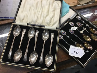 Lot 737 - Six silver beaded old English pattern teaspoons in fitted case together with a set of six silver and enamel teaspoons in fitted case (2 sets)