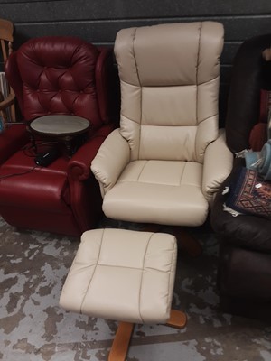 Lot 1049 - Contemporary cream leather reclining and revolving chair with matching footstool