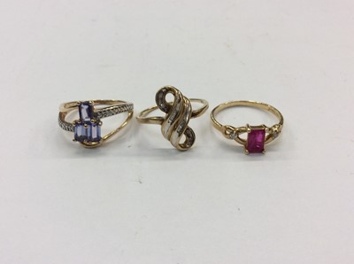 Lot 747 - Three 10K gold diamond and gem set dress rings