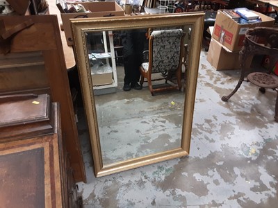 Lot 1056 - Bevelled wall mirror in gilt frame and an Edwardian oak framed dressing table mirror