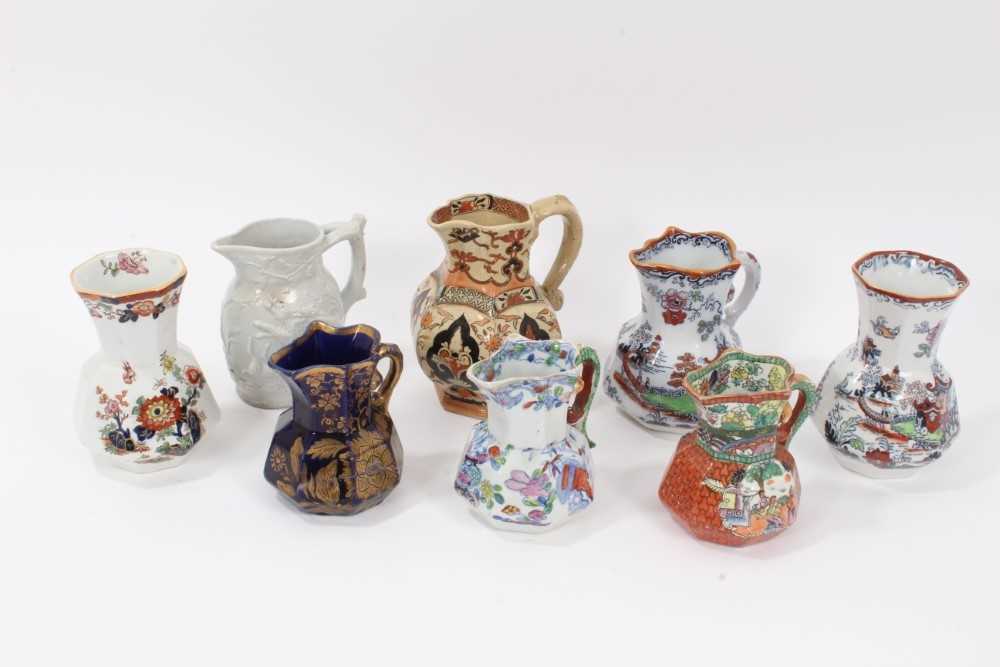 Lot 68 - A rare Masons Ironstone relief moulded jug, five other Masons jugs and two tooth brush vases