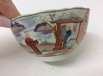 Lot 17 - A New Hall 'Boy at the Window' teapot and cover, three similar coffee cups and bowl