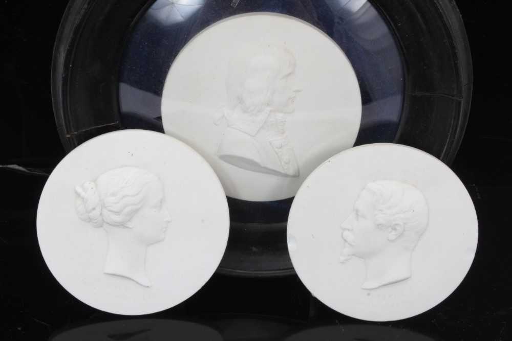Lot 75 - Three 19th century Sevres biscuit porcelain round plaques