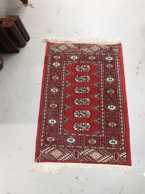 Lot 1110 - Four small Eastern rugs with geometric decoration