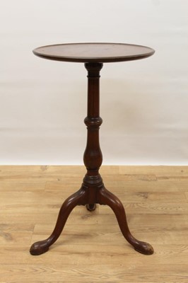 Lot 343 - George III mahogany tripod wine table, with circular top on turned and shaped column and three splayed legs with pad feet, 42cm diameter x 74cm high