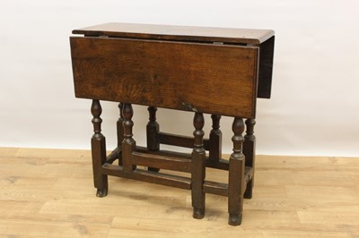 Lot 1468 - Late 17th century oak drop-flap table of small proportions, on turned supports joined by stretchers, 76cm x 70cm when open