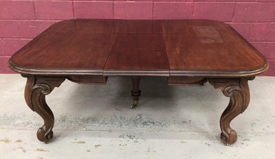 Lot 1465 - Good quality 19th century mahogany wind-out extending dining table, the rectangular moulded top with rounded ends, on carved scroll cabriole legs terminating on brass castors, with three extra leav...