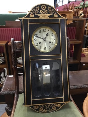 Lot 98 - 1920s wall clock with 8 day striking movement in Arts & Crafts-style gilded black lacquered case