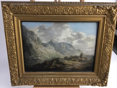 Lot 240 - After J. M. Turner, 19th century, oil on paper laid on panel - cottage beneath hills, bearing signature, in gilt frame, 27cm x 37cm