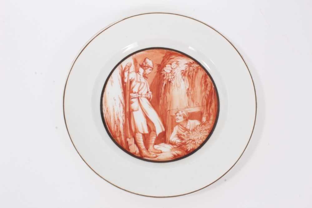 Lot 2 - Rare Soviet Russian Revolution propaganda plate, finely painted in sepia with two Soviet soldiers in conversation in a trench  and fully inscribed in Cyrillic and signed by the artist on the unders...