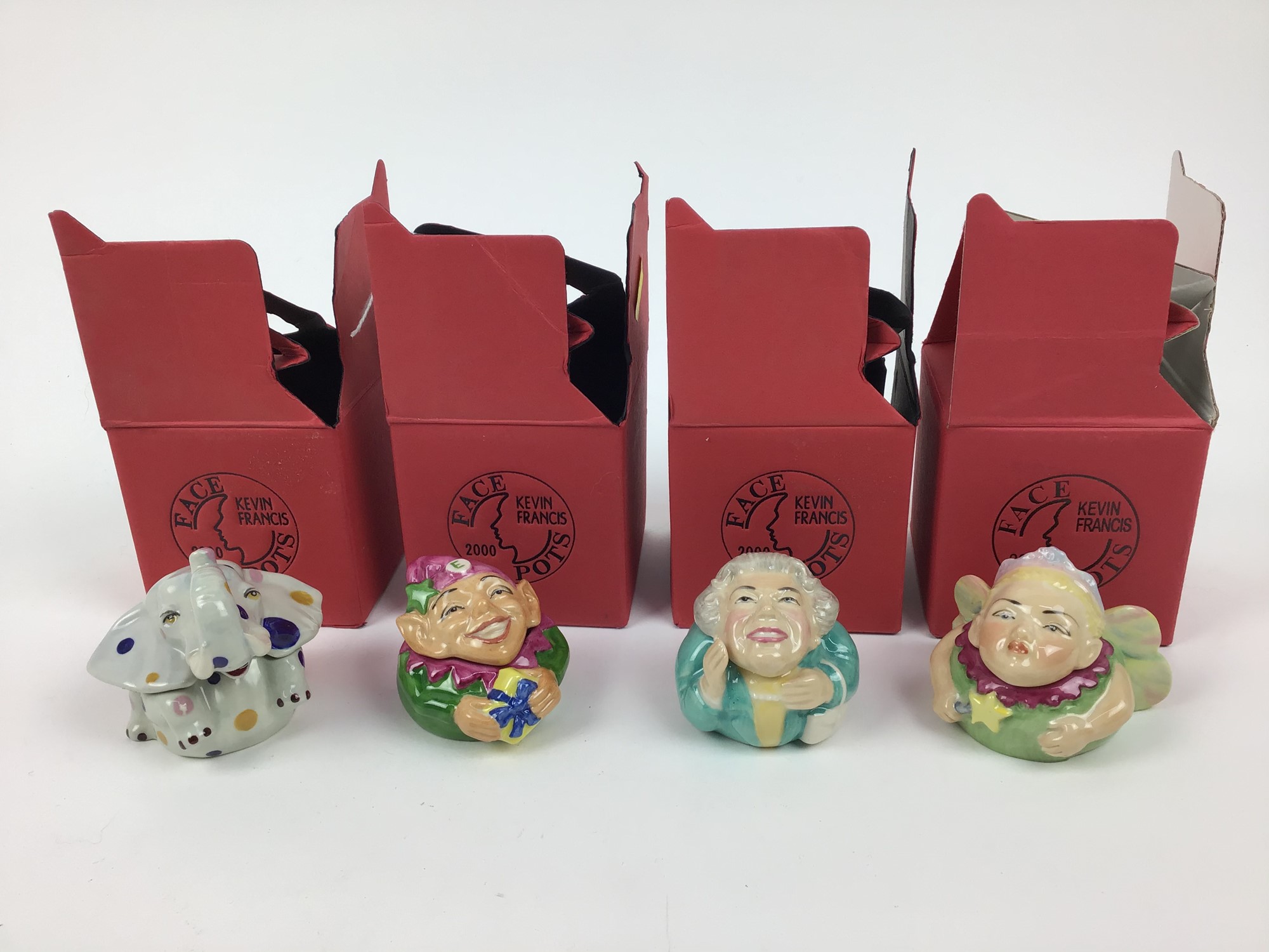 Lot 201 Sixteen Kevin Francis face pots