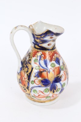 Lot 69 - Selection of early 19th century miniature English porcelain, including a Spode jug and basin, a Crown Derby jug, and a pair of floral painted bottle vases (5), the largest measuring 8.75cm height