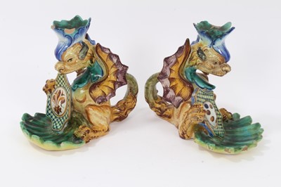 Lot 25 - Pair of Cantagalli maiolica candlesticks, in the form of heraldic dragons with scallop shell bowls, cockerel marks, 15.5cm height