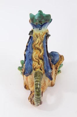 Lot 25 - Pair of Cantagalli maiolica candlesticks, in the form of heraldic dragons with scallop shell bowls, cockerel marks, 15.5cm height