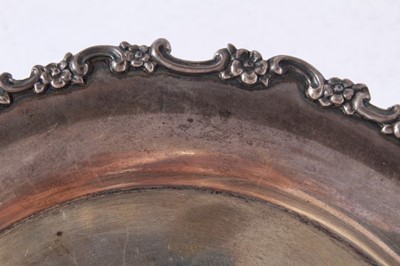 Lot 63 - Late 19th century American silver card tray of circular form with floral and scroll border and central engraved initials, by Tiffany & Co, marks circa 1892 - 1902, together with a letter of provena...