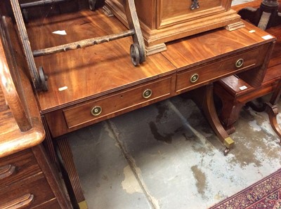 Lot 1012 - George III style mahogany sofa table with two drawers on end standards with splayed legs on brass castors