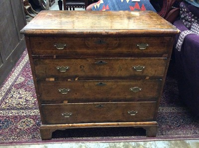 Lot 1053 - George I style burr walnut veneered chest of four long graduated drawers with brass handles on bracket feet