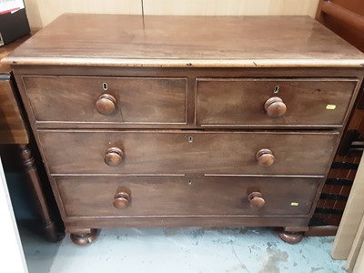 Lot 1054 - Victorian mahogany chest of two short and two long drawers with bun handles on turned feet