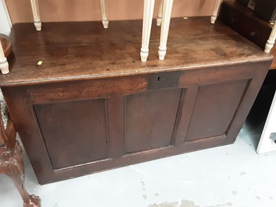Lot 197 - 18th century panelled oak coffer with plank top and panelled front