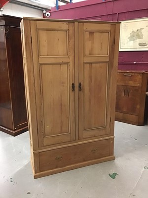 Lot 909 - Antique pine wardrobe enclosed by two doors with drawer below