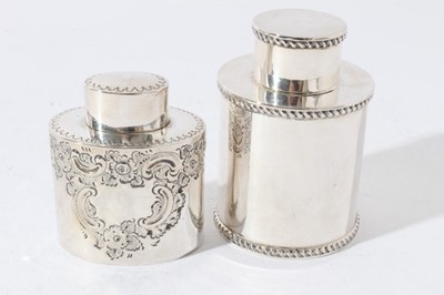 Lot 71 - George V silver tea caddy of cylindrical form with push fit cover and gadrooned borders (Chester 1915) together with another similar silver tea caddy (Sheffield 1894) all at 7oz, larger caddy 10cm...