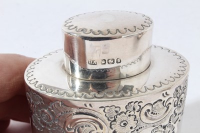 Lot 71 - George V silver tea caddy of cylindrical form with push fit cover and gadrooned borders (Chester 1915) together with another similar silver tea caddy (Sheffield 1894) all at 7oz, larger caddy 10cm...