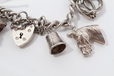 Lot 211 - Silver charm bracelet with sixteen silver charms