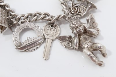Lot 211 - Silver charm bracelet with sixteen silver charms