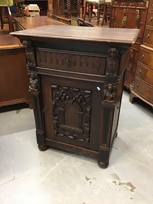 Lot 906 - Late Victorian carved oak cupboard