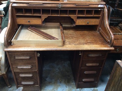 Lot 1008 - Early 20th century oak twin pedestal roll top desk