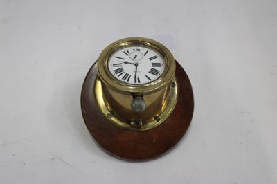 Lot 1861 - Early 20th century 8 Day car clock by Doxa in circular brass case