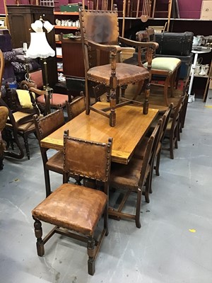 Lot 903 - 1920s carved oak sideboard, draw-leaf dining table and six chairs