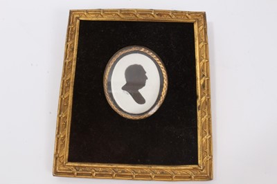 Lot 27 - Victorian memorial portrait photograph of an Earl in black enamel and gilt metal oval mount with Earls coronet and JD monogram cresting on velvet ground with gilt metal easel back, 18.6 x 16 cm