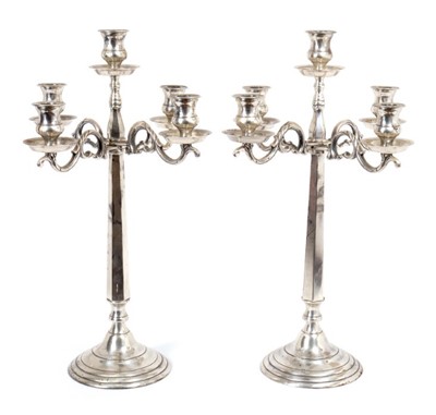 Lot 455 - Pair of Swedish silver plated four branch candelabra