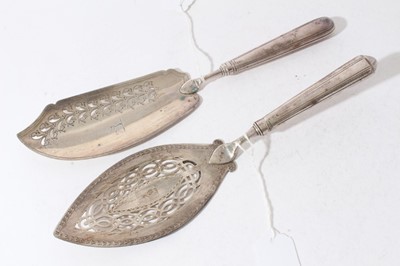 Lot 158 - George III silver fish slice with curved pierced blade and brite cut engraved decoration (London 1800), together with another similar (London 1787), 31 and 30cm in length (2)