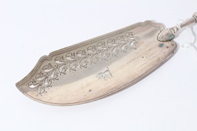 Lot 158 - George III silver fish slice with curved pierced blade and brite cut engraved decoration (London 1800), together with another similar (London 1787), 31 and 30cm in length (2)
