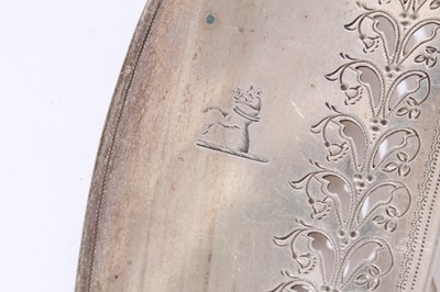 Lot 158 - George III silver fish slice with curved pierced blade and brite cut engraved decoration (London 1800), together with another similar (London 1787), 31 and 30cm in length (2)