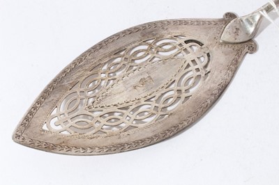 Lot 158 - George III silver fish slice with curved pierced blade and brite cut engraved decoration (London 1800), together with another similar (London 1787), 31 and 30cm in length (2)