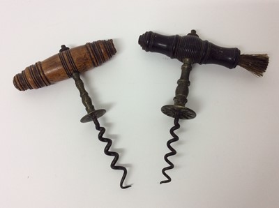 Lot 187 - Two 19th century corkscrews with turned wooden handles, one with brush