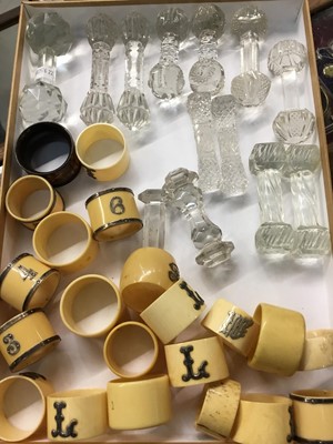 Lot 216 - Collection of assorted Victorian and later napkin rings, some with silver mounts, ivory and bone, together with a collection of Victorian glass knife rests m