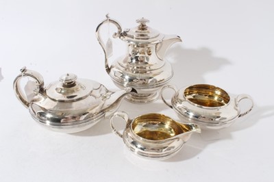 Lot 126 - George IV silver four piece teaset, comprising teapot of squat form with central band of reeded decoration, engraved initials, domed hinged cover and loop handle with ivory insulators