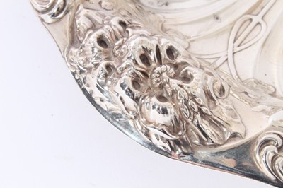 Lot 125 - American silver dish of shaped circular form with embossed floral decoration, maker Gorham & Co, stamped Sterling and numbered A5626, all at approximately 10oz, approx, 26cm in diameter.